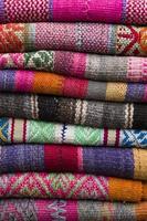 Colorful traditional peruvian fabrics on the market photo