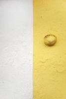 Two tone yellow and white concrete wall photo