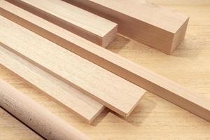 Group of assorted wood material like planks, squares, sheets, timber for carpentry photo