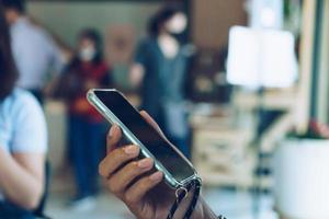 Person's hand using smartphone to do work business photo