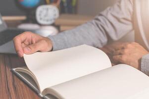 Human reading a book to increase knowledge photo