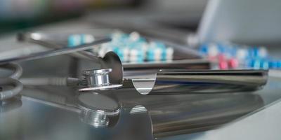 Stethoscope and medicine close-up photo