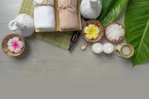 Top view, composition of spa treatment on wooden table photo