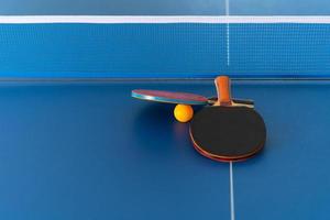 Table tennis racket and ball photo