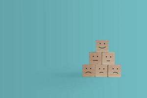 Smiley face icon on wood cubes photo