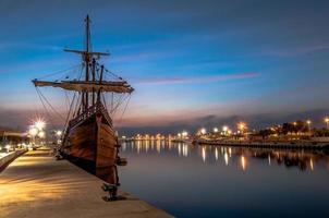 Galleon ship in the port photo