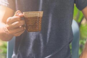 Man holding coffee cup photo