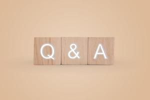 Q and A alphabet on wooden cubes with background photo