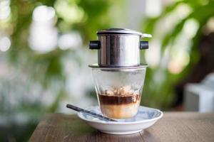 Affogato coffee with ice cream on a glass cup on a blurry background photo