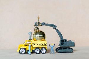 Miniature workers working on Christmas decorations, Christmas and Happy New Year concept photo
