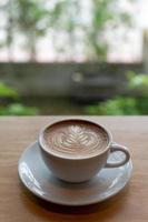 arte latte en una taza de café foto