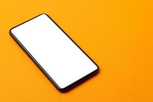 Blank phone on orange photo