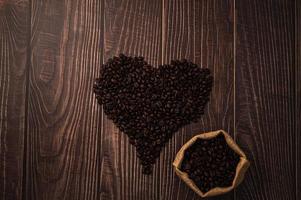 Coffee beans arranged in a heart shape photo