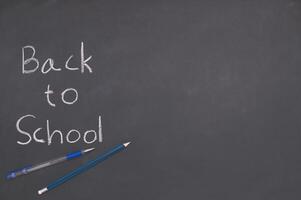 Back to school and education concept on blackboard photo