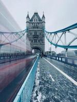 Blurred double decker on Tower Bridge, UK photo