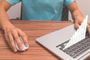 Businessman using laptop for analysis and financial concept photo