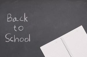 Back to school and education concept book on blackboard photo