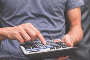 A human using a calculator photo