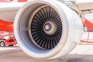 Airplane engine on the wing of an airplane on the runway photo