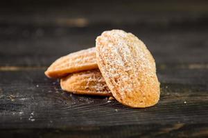 Pile of oat cookies on wooden table photo