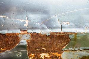 Close-up of chipped paint and rusted metal photo