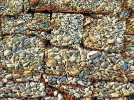 Detalle de la pared de piedra al aire libre para el fondo o la textura foto
