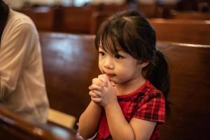 Little girl praying photo