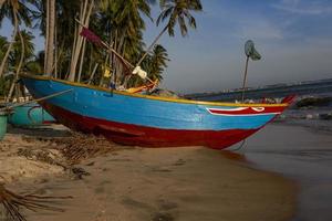 Fishing boat at the beach in Vietnam photo