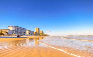 Shoreline, beach, and row of resorts at Daytona Beach, Florida photo