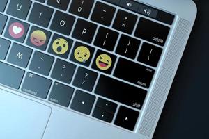 2018-- editorial ilustrativa de emojis sobre teclado de computadora
