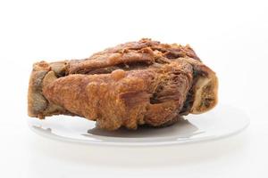 Crispy German pork knuckle on white background photo