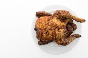 Grilled chicken on white background photo