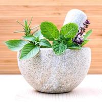 Fresh herbs in a mortar photo