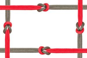 Different ropes tied together isolated on a white background photo