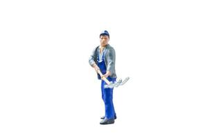 Miniature construction worker concept isolated on a white background photo