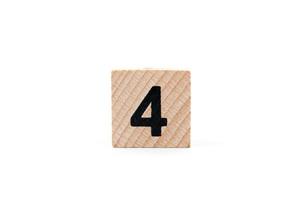 Wooden block number four on a white background photo