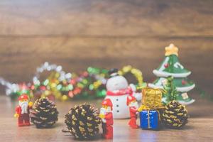 Chiang Mai, Thailand - September 4, 2017, Lego Santa Claus miniatures with a Christmas tree depicting a festive, Christmas scene on a wooden background photo