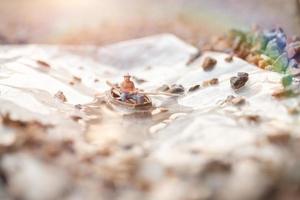 Miniature fisherman fishing on a boat photo