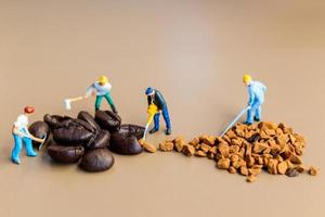 Miniature teams working together on coffee blending photo