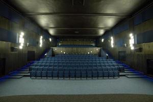 Empty comfortable blue seats in empty cinema photo