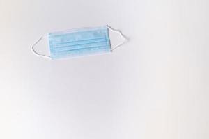 Surgical mask on white background photo