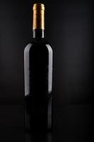 Wine bottle with black background photo