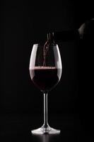 Closeup wine glass filling photo