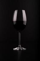 Wine glass with black background photo