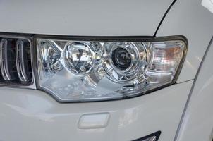 White car headlight photo