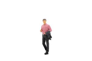 Miniature businessman standing isolated on a white background