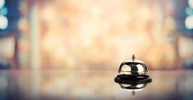 Bell on a counter for service with a blurred background photo