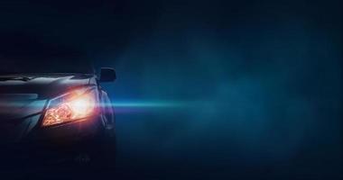 Front of a sports car on a dark background with text for space photo