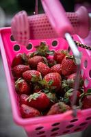 Strawberries in a pink basket