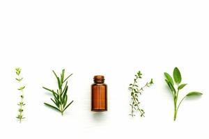 Essential oil and herbs with copy space photo